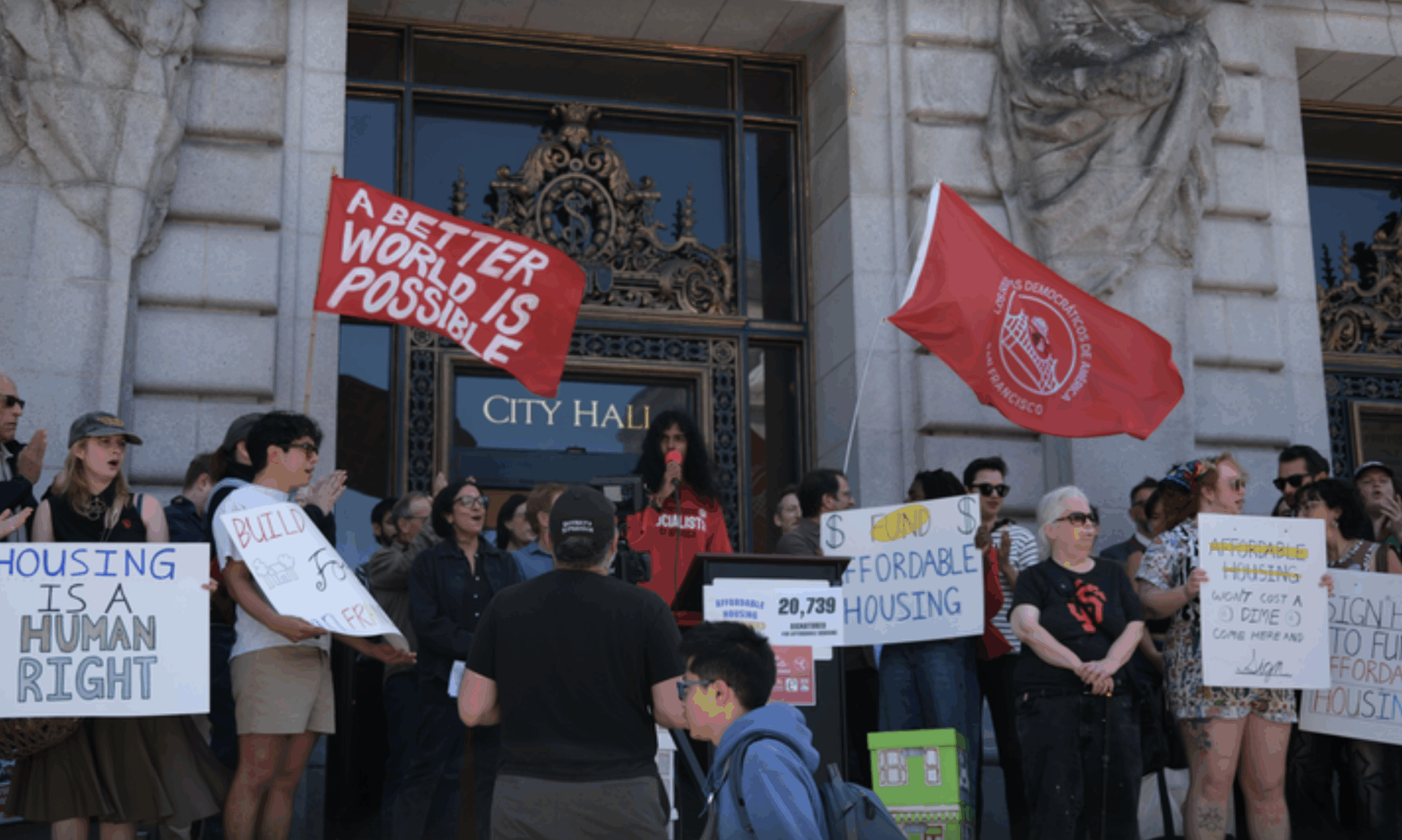 Picture of Affordable Housing Guarantee Act activists at city hall with posters
